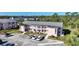 Exterior view showing well-maintained building with parking, landscaping, and inviting balconies at 179 Boundary Blvd # 4, Rotonda West, FL 33947