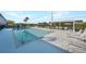 Relaxing community pool with ample lounge chairs and shaded pavilion for residents' enjoyment at 179 Boundary Blvd # 4, Rotonda West, FL 33947