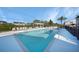 Inviting community pool area with comfortable lounge seating and a shaded pergola at 179 Boundary Blvd # 4, Rotonda West, FL 33947