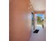Side porch with view of blue sky, black door mat and outdoor sconce light at 179 Boundary Blvd # 4, Rotonda West, FL 33947