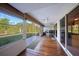 Enclosed porch offers a relaxing view to a large yard at 179 Boundary Blvd # 4, Rotonda West, FL 33947