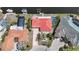 Aerial shot highlighting the red tile roof, screened pool, and waterfront access, perfect for serene coastal living at 1791 Belle Ct, Punta Gorda, FL 33950