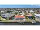 Stunning aerial view of a waterfront home with a private pool and dock, ideal for luxurious coastal living at 1791 Belle Ct, Punta Gorda, FL 33950