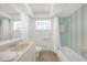 Clean bathroom with light blue accents, includes shower and window for natural light at 1791 Belle Ct, Punta Gorda, FL 33950