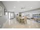 Bright, open-concept dining area with modern furnishings and natural light, adjacent to the living room at 1791 Belle Ct, Punta Gorda, FL 33950