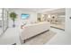 Bright living room with a seamless flow into the dining area, showcasing the open floor plan and modern design at 1791 Belle Ct, Punta Gorda, FL 33950