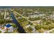 Panoramic aerial view showcasing the property's waterfront location and the surrounding community with lush greenery at 18417 Ohara Dr, Port Charlotte, FL 33948