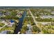 Aerial shot of the property highlighting its canal-front location and proximity to surrounding neighborhoods and waterways at 18417 Ohara Dr, Port Charlotte, FL 33948