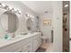 Bathroom with dual sinks, neutral walls and plenty of vanity space and a walk-in shower at 18417 Ohara Dr, Port Charlotte, FL 33948