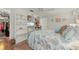 Bedroom with built-in bookshelves and television for entertainment, and a large bed at 18417 Ohara Dr, Port Charlotte, FL 33948