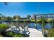 Beautiful dock with lounge chairs overlooking the canal, perfect for relaxing outdoors and enjoying waterfront views at 18417 Ohara Dr, Port Charlotte, FL 33948