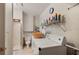 Functional laundry room with washer, dryer, storage shelves, toilet and a small shower at 18417 Ohara Dr, Port Charlotte, FL 33948