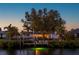 Evening shot of a waterfront home with dock lighting up the serene waterway at 18417 Ohara Dr, Port Charlotte, FL 33948