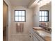 Well-lit bathroom with a granite vanity top, sink, and ample counter space at 18462 Alphonse Cir, Port Charlotte, FL 33948