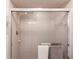 Bathroom shower with glass doors, a mounted shower head, and convenient towel bars at 18462 Alphonse Cir, Port Charlotte, FL 33948