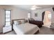 Comfortable bedroom with two beds, natural light, and neutral decor at 18462 Alphonse Cir, Port Charlotte, FL 33948