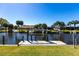 Waterfront property featuring a private dock on a scenic canal at 18462 Alphonse Cir, Port Charlotte, FL 33948