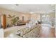 Bright living room featuring neutral tones, comfortable seating, and tile flooring at 2024 Calusa Lakes Blvd, Nokomis, FL 34275