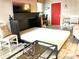 Multi-purpose room featuring a murphy bed with an open concept kitchen in the background at 21405 Olean Blvd # 308, Port Charlotte, FL 33952