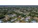 Neighborhood aerial view showcasing tree-lined streets and single-Gathering homes with spacious yards at 23051 Elmira Blvd, Punta Gorda, FL 33980