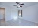 Bedroom with tiled floor, ceiling fan, and neutral colored window curtains at 23051 Elmira Blvd, Punta Gorda, FL 33980
