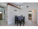 Dining area with dark wood table, view of bathroom, and light fixture at 23051 Elmira Blvd, Punta Gorda, FL 33980