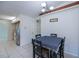 Dining area with dark wood table and chandelier lighting at 23051 Elmira Blvd, Punta Gorda, FL 33980
