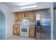 Kitchen features stainless steel refrigerator and white appliances, butcher block countertop at 23051 Elmira Blvd, Punta Gorda, FL 33980