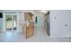 Open kitchen with butcher block counters, stainless steel appliances, and slider to backyard at 23051 Elmira Blvd, Punta Gorda, FL 33980