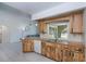 Inviting kitchen showcases butcher block counters, neutral paint, and view to the living room at 23051 Elmira Blvd, Punta Gorda, FL 33980