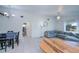 Open concept living room and dining area with tile floors and views to other rooms of the house at 23051 Elmira Blvd, Punta Gorda, FL 33980