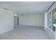 Bright living room with neutral tile, large windows providing plenty of natural light and a view of the outdoors at 23051 Elmira Blvd, Punta Gorda, FL 33980