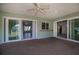 Covered patio featuring neutral textured flooring and multiple access points to the home's interior at 23051 Elmira Blvd, Punta Gorda, FL 33980