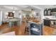 Open concept showcasing the kitchen with island and dining area, seamlessly connected to the living room at 24055 Buckingham Way, Punta Gorda, FL 33980