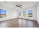Bright bedroom with ample windows, natural light, and wood-look tile flooring at 24166 Colima Ct, Punta Gorda, FL 33955