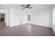 Bright bedroom with tile floors, ceiling fan, and a large window offering ample natural light at 24166 Colima Ct, Punta Gorda, FL 33955