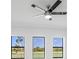 A modern ceiling fan with sleek black blades complements the room's contemporary design at 24166 Colima Ct, Punta Gorda, FL 33955