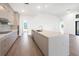 Spacious kitchen with island, stainless steel appliances, and light-colored cabinetry at 24166 Colima Ct, Punta Gorda, FL 33955