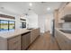 Open-concept kitchen featuring an island, stainless steel appliances, and backsplash at 24166 Colima Ct, Punta Gorda, FL 33955
