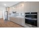Modern kitchen with stainless steel appliances, sleek cabinets, and countertop at 24166 Colima Ct, Punta Gorda, FL 33955