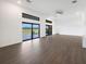 Bright living room showcasing large windows and sliding doors with backyard views at 24166 Colima Ct, Punta Gorda, FL 33955