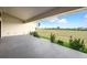 A covered patio provides a relaxing outdoor space with landscaped views at 24166 Colima Ct, Punta Gorda, FL 33955