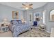 Cozy bedroom with neutral walls, white furnishings, and floral accents at 24371 Westgate Blvd, Port Charlotte, FL 33980