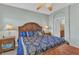Bedroom with a large, comfy bed, arched entryway, bedside lamps, and neutral-colored walls at 24371 Westgate Blvd, Port Charlotte, FL 33980