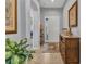Inviting foyer with tile flooring, neutral paint, elegant decor, and a clear view into the adjacent living space at 24371 Westgate Blvd, Port Charlotte, FL 33980