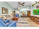 Cozy living room with comfortable seating, recessed lighting, and seamless transition to the dining area at 24371 Westgate Blvd, Port Charlotte, FL 33980