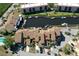 Aerial view of waterfront townhomes with private boat docks on a canal and community landscaping at 25188 Marion Ave # 1013, Punta Gorda, FL 33950