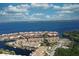 Aerial view showcasing the coastal community, boat docks, beautiful waterfront access, and meticulously manicured landscaping at 25188 Marion Ave # 1013, Punta Gorda, FL 33950