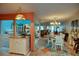 Inviting dining room with chandelier and unique decorative rug at 25188 Marion Ave # 1013, Punta Gorda, FL 33950