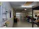 View of the garage featuring a durable roll-up door, shelving, and ample storage solutions at 25188 Marion Ave # 1013, Punta Gorda, FL 33950